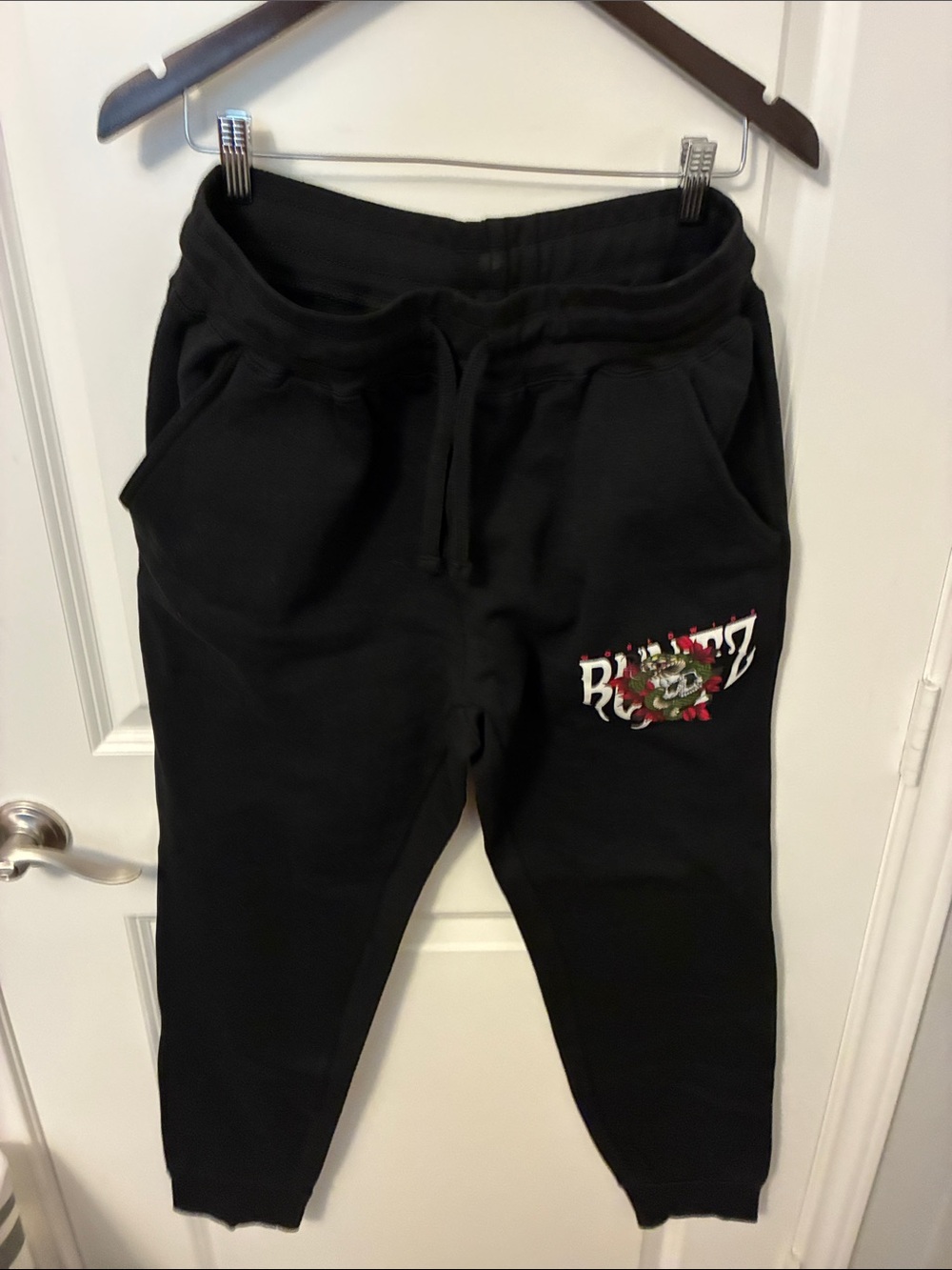 Black Graphic Jogger Sweatpants with Floral Crest Accent